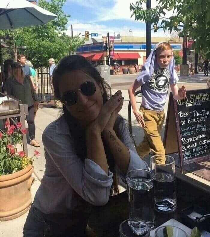 Post Your Funniest Screenshot of a Random Face in the Background of a Photo